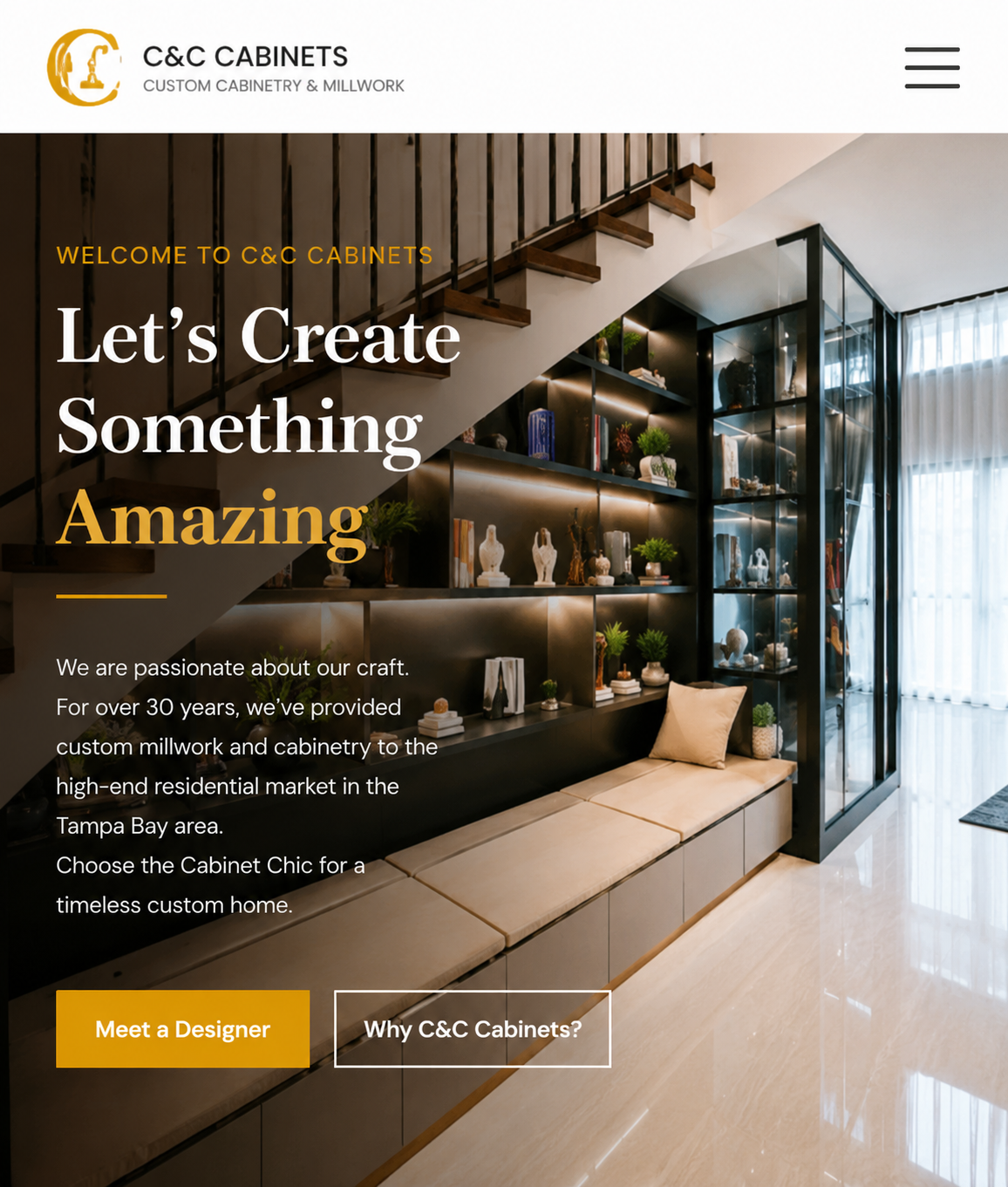 webflow developer Modern showroom interior with dark open shelving and glass cabinets displaying decor, under a staircase; text overlay reads 'Let's Create Something Amazing' and 'Welcome to C&C Cabinets'.